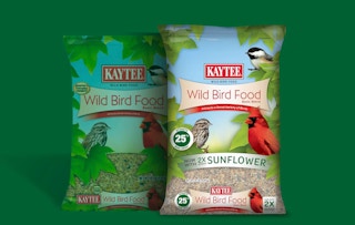 bags of bird seed on a green background