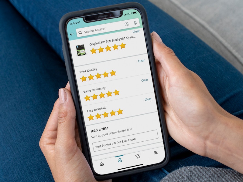 A person writing a product review on the Amazon app.