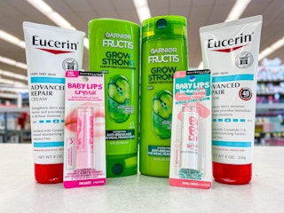 Eucerin hand creams, Garnier Fructis shampoo and conditioner, and Maybelline Baby Lips on counter