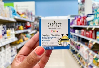 hand holding box of Zarbees baby soothing chest rub