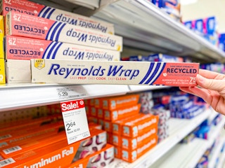 hand grabbing reynolds wrap off a target shelf