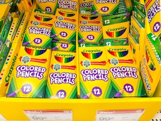 Crayola colored pencils on display at Target with sale signs pricing them at 99 cents.