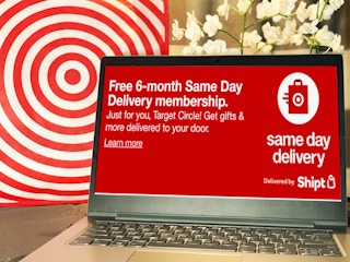 laptop in front of target bag and orchids with same day delivery by shipt