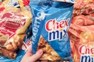 hand holding a bag of chex mix snacks