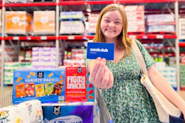 person holding sams club membership card