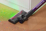 Lifestyle image of a cordless vacuum being used to clean up crumbs on the floor