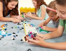 Kids bulding lego creations during a Lego Build Event