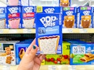 hand holding frosted blueberry pop-tarts