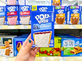 hand holding frosted blueberry pop-tarts