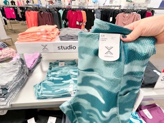 hand holding women's workout leggings