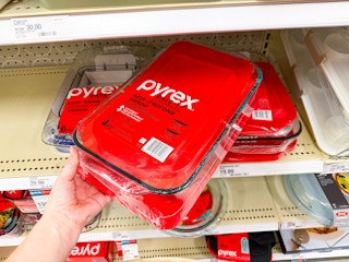 hand grabbing a pyrex bakeware set off a target shelf