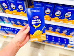 hand holding kraft mac & cheese box at walmart