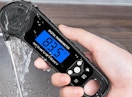 a hand holding a meat thermometer 