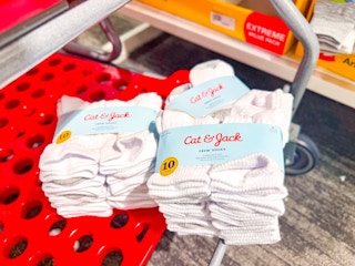 cat & jack kids' sock packs sitting on a bottom of a target cart