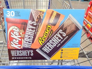 box of full-size candy bars in a cart