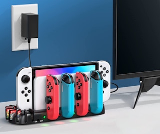 nintendo switch and games on a charging station