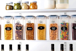 food in storage containers lined up on shelves