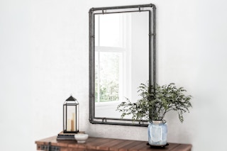 Lifestyle image of Aspire Home Accents Mirror  hanging on wall inside a home 
