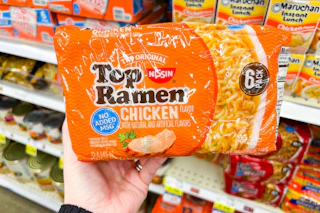 hand holding a pack of top ramen
