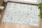 Lifestyle image of area rug by door inside home