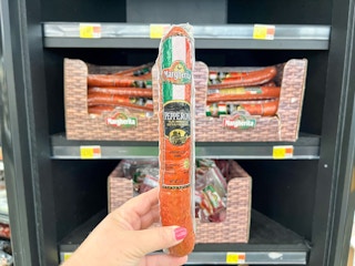 hand holding margherita pepperoni log at walmart