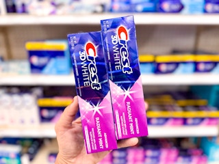 hand holding two crest 3d advanced toothpastes at target