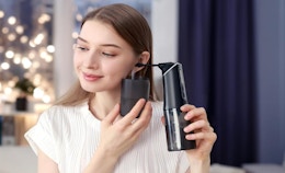 a person using a ear wax removal device 