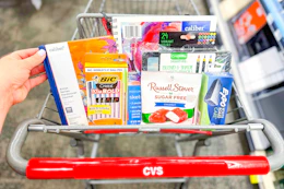 cart full of clearance items including pens, journals, sketchbooks, colored pencils, and more