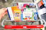 cart full of clearance items including pens, journals, sketchbooks, colored pencils, and more