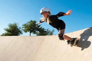 Roller Derby Skateboard Lifestyle Image of child skateboarding on ramp from walmart.com
