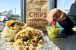 a person eating at chipotle