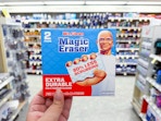 hand holding mr. clean magic erasers in walgreens