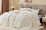 white fleece comforter on bed