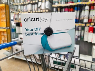 Cricut Joy on the edge of a Walmart shopping cart