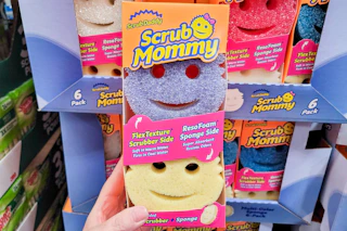 hand holding scrub mommy sponge set