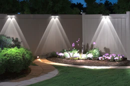 solar lights on a wooden fence outside