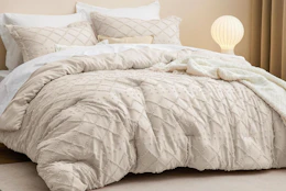 a comforter set on a bed