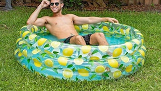 stock image of man in lemon pool