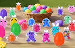 a table with colorful Easter toys and Easter eggs