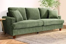 Lifestyle image of a green corduroy sofa in a home setting