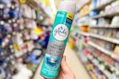 hand holding glade air freshener mist at dollar general