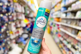 hand holding glade air freshener mist at dollar general