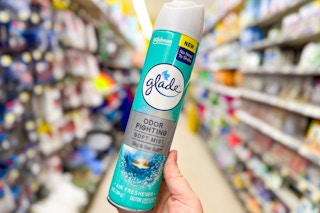 hand holding glade air freshener mist at dollar general