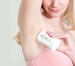 a person applying deodorant