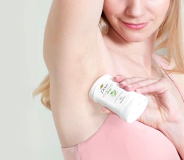 a person applying deodorant