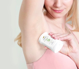 a person applying deodorant