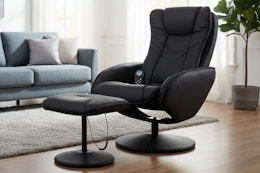 a faux leather massage chair with an ottoman