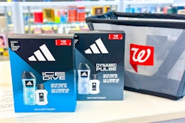 2 adidas gift sets on a shelf with a walgreens shopping basket