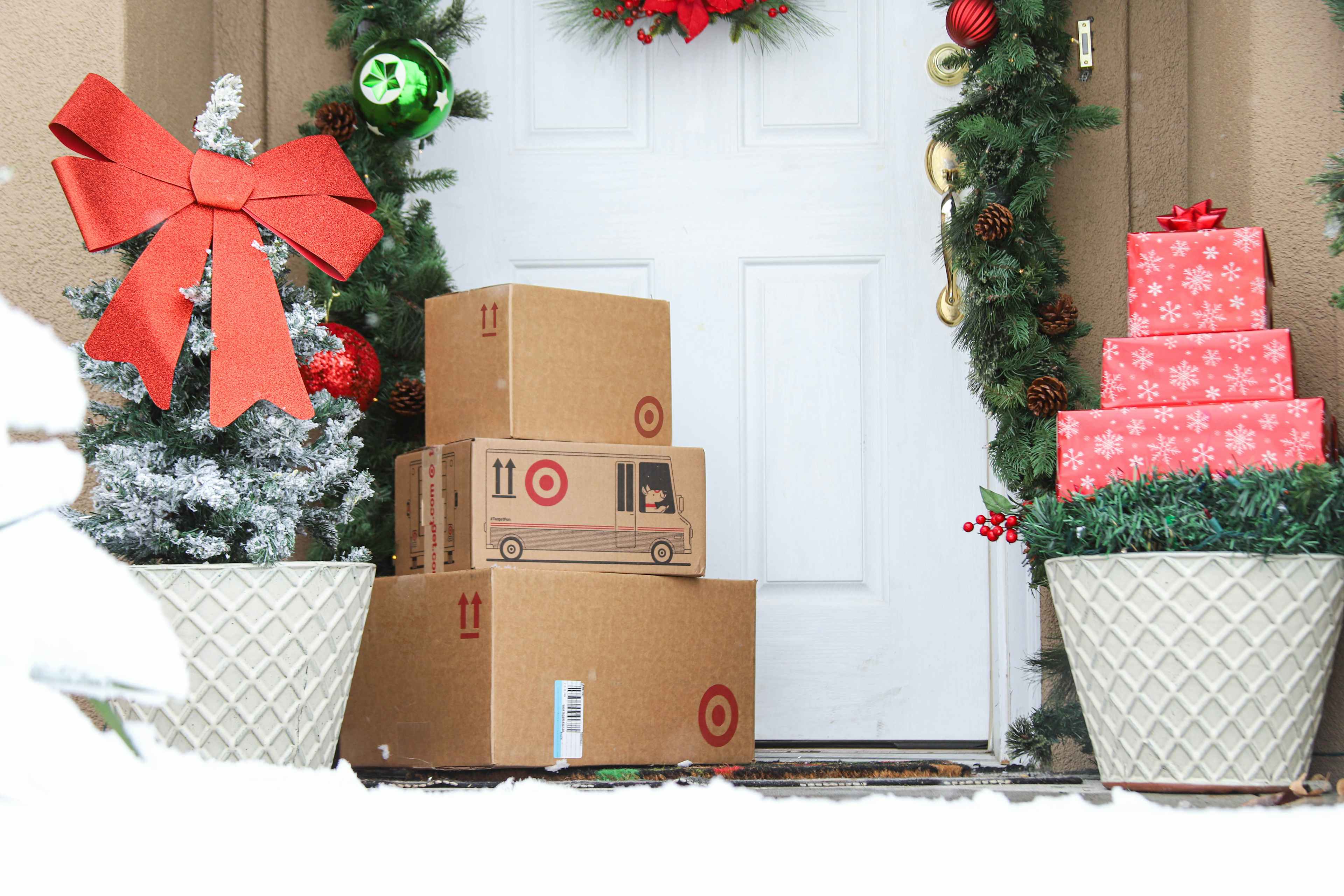 a stack of target boxes on winter doorstep