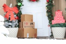 a stack of target boxes on winter doorstep